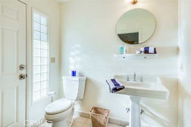 Powder Room attached to Family Room with direct access to Backyard.