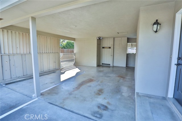 This open garage space was designed to fit a tall boat or camper on one side, watch your step.