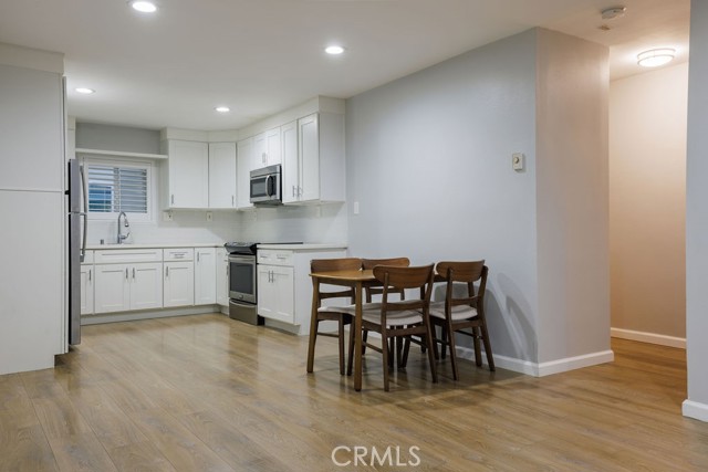 Kitchen and dining area with entry to the hallway