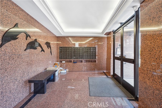 The Main Lobby is Richly Appointed with Marble Finishes and has the Mailboxes Conveniently Located