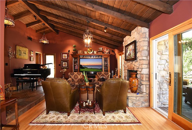 Family room with fireplace and access to outdoor patio area