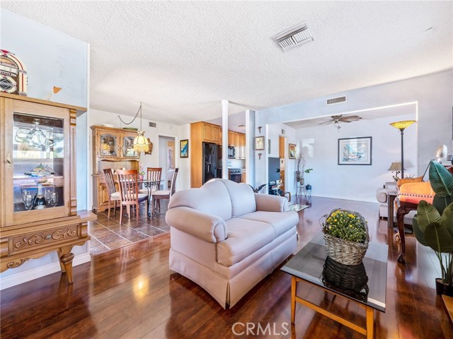 Living area with view to the dining room.