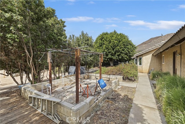 Back yard green house and garden area location