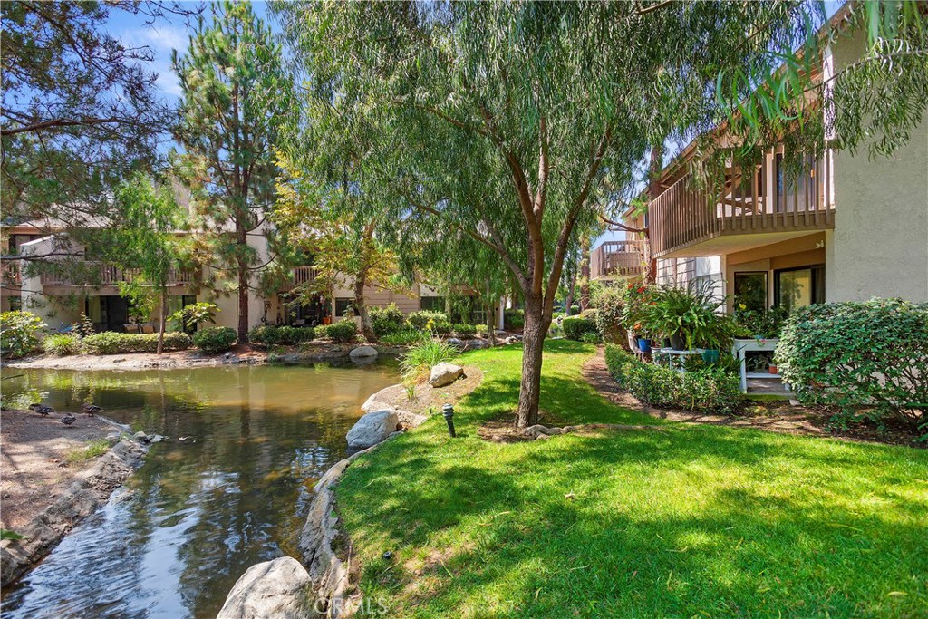 ONE OF THE BEST LOCATIONS IN QUAIL CREEK COMMUNITY. END UNIT WITH UNOBSTRUCTED VIEWS. The sounds  of running streams and soothing ponds encompass this very private upper end unit with cathedral ceiling.   Highly upgraded with extensive custom woodworking throughout. Upgrades include custom kitchen cabinets, stone counters,closet organizers, custom lighting, cathedral ceilings, skylight, and large deck off the living room.  Association two pool/spa's, sauna, two tennis courts.  Covered 160SF Carport, space #679.  Laundry closet for stack washer/dryer in master bedroom.