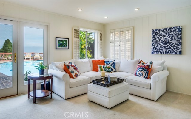 Spacious family room with wet bar opens to pool, patio and enjoys the spectacular view.