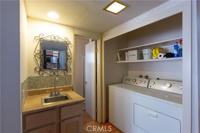 Convenient inside laundry area, and behind the door is a 3/4 bath for the lower level