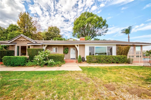 Front view with front yard, direct access to pool area with city view