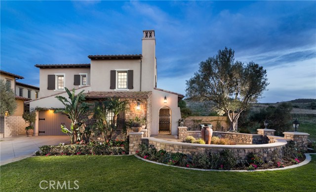 14 Midnight Sun Irvine, California Enjoy one of the "Crown Jewel" estate homes on a cul-de-sac at the top of Quail Hill on one of Irvine's highest points with remarkable 270 degree city lights and canyon views! This gorgeous 5 Bedroom | 5 Bath | 4,430 sf "Vicara Plan 3" home offers unmatched privacy on a 8,843 SF wrap-around lot. Enjoy a cup of coffee and a morning sunrise, or a glass of wine taking in an evening sunset or Disneyland fireworks. The first floor includes an open floor plan, a beautiful living suite, office, hardwood floors throughout, and new designer paint. The Chef's Dream Kitchen includes granite countertops, 6 burner stove and griddle, and upgraded appliances. The upstairs includes private balconies, large windows, crown molding, and plantation shutters. The large master suite, includes his/her walk-ins, spa-like master bath, and additional exercise room with french doors onto the large balcony. The beautiful backyard is perfect for entertaining, including a California Room, water fountain, bbq area, fire pit, grape vines, 3 side yard seating areas - along with a wrap-around lot! 2 car garage includes charging port for electric vehicles. Enjoy the resort-syle living of Quail Hill with 3 Olympic swimming pools, hiking/biking trails, tennis/sport courts, private fitness centre, clubhouses, and more! Within Irvine's award winning University High School District. Minutes from Laguna Beach, John Wayne Airport, 405, 5, and 133 freeways, and world-class shopping, golf, and dining. Welcome home!
