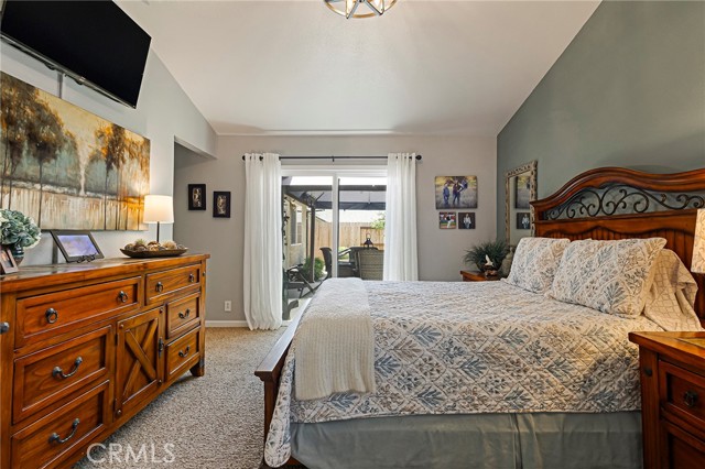 Primary suite with slider access to backyard