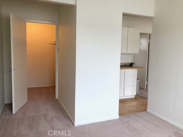 Bedroom View of Kitchenette and Walk-In Closet