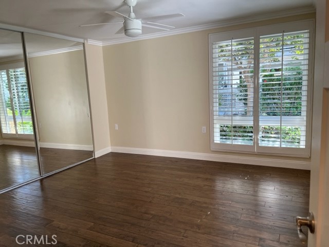 The Primary Bedroom has a ceiling fan and lots of windows to let in the light and fresh coastal breezes.