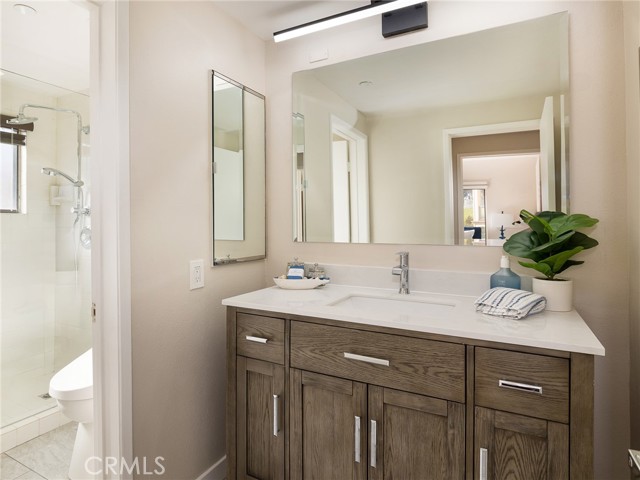 2nd bathroom has nice looking vanity & mirror