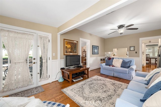 Family room french doors to yard on left, office entrance in the middle, kitchen door on right.