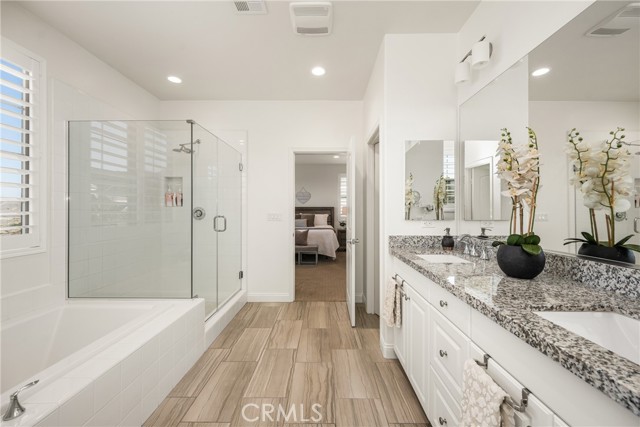 Spacious Primary Bath with Dual Vanity and Glass Shower