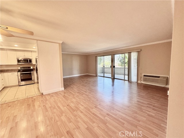 Open-concept layout seamlessly connects the dining area and living room—ideal for entertaining and everyday comfort.