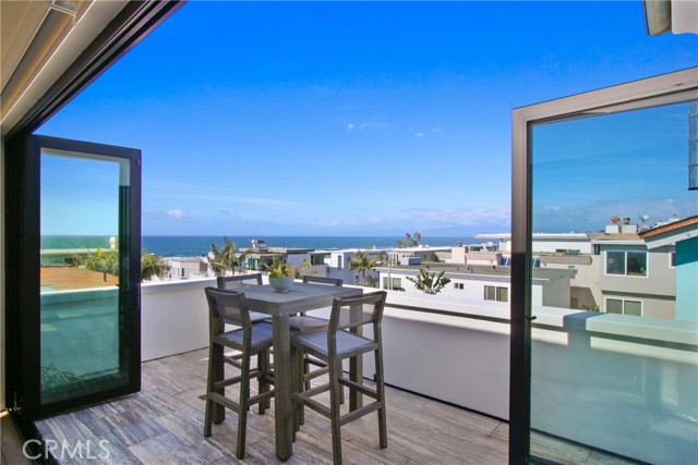 deck off living room with ocean views