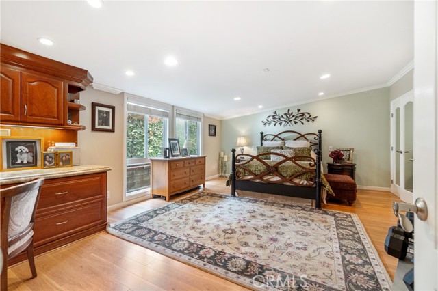 Master bedroom showing large sitting area and built in desk