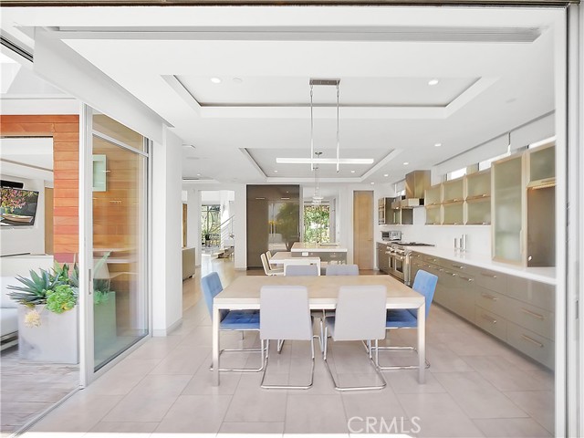 Floor to ceiling glass doors for indoor/outdoor flow.