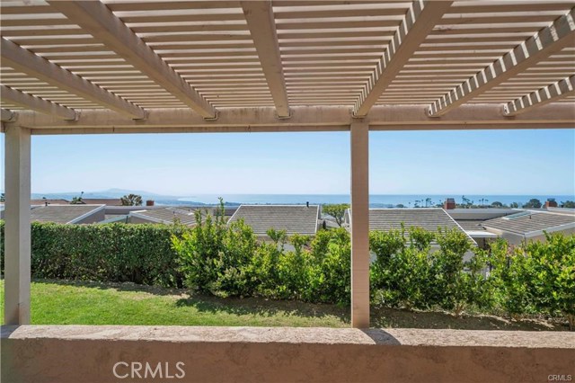 Views down the coastline as far as the eye can see! Not many homes offer this kind of view, much less a single story. Can you see yourself sitting on this patio enjoying the cool ocean breeze with a beverage of choice or perhaps an al fresco meal? The possibilities are like the view...endless!
