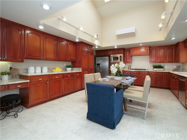 Kitchen with granite counters and maple cabinets including large pantry