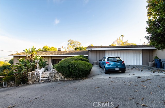 Attached 2-car garage on upper level with 2 side-by-side parking spaces