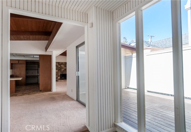 Really nice atrium is accessed from dining room (in picture) and living room 9with fireplace at back of picture).