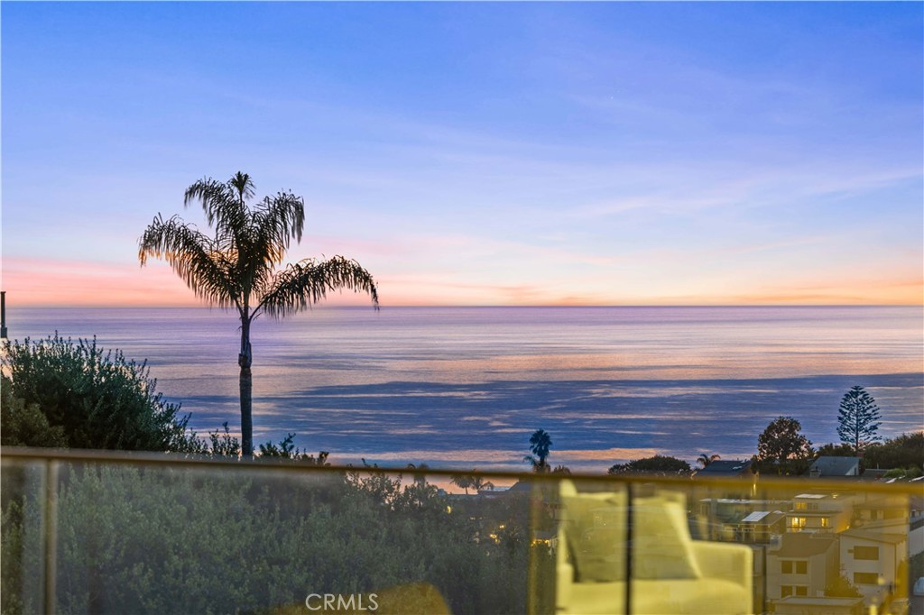 Fascinating Frontal Ocean View , valley view and city lights.Welcome to 1041 Santa Ana St, a delightful coastal gem nestled in the heart of Laguna Beach. This beautifully fully upgrade home offers a perfect blend of modern comfort and classic beach charm. With 4 spacious bedrooms, 3.5 baths, 2119sqft and over 5000 sq ft of Lot size, this property provides the ideal setting for both relaxation and entertaining.
Step inside to find a bright and airy open-concept floor plan featuring high ceilings, large windows, and stunning ocean views. The living area flows seamlessly into the gourmet kitchen, complete with quartz countertops, stainless steel appliances, and a center island that’s perfect for casual dining or gatherings. 
The master suite is a tranquil retreat, offering breathtaking views, a luxurious en-suite bath with dual vanities, a soaking tub, and a walk-in shower. Step outside to the private balcony to take in the cool ocean breeze and panoramic sunsets. Two additional bedrooms offer ample space for family or guests with oceano view, with a shared modern bathroom featuring designer finishes.
The first floor features a room ,powder room and big yard, because this house has two APN, the house itself has a lot size of 2500 sqft, and comes with an additional 2500 Sqft lot, the yard is beautifully landscaped and is ideal for hosting summer picnics or relaxing a day at the beach.
Located in one of Southern California’s most coveted communities, this home is just minutes from pristine beaches, award-winning restaurants, and world-class art galleries. Nearby, you’ll find top-rated public schools and parks, along with convenient shopping at local boutiques and markets. For outdoor enthusiasts, hiking trails and nature reserves offer endless opportunities for exploration.
Commuting is a breeze with easy access to Pacific Coast Highway (PCH) and public transportation options, including the Laguna Beach Trolley, which offers free rides around town and to nearby attractions. Whether you’re heading into town or commuting to neighboring cities, this home provides seamless connectivity to everything Laguna Beach and the surrounding area have to offer.
Don’t miss the opportunity to own this enchanting home in one of Southern California’s premier coastal destinations.