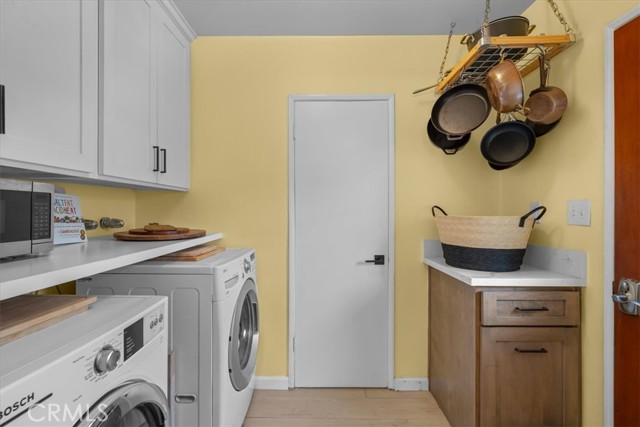 Laundry room with cabinet space