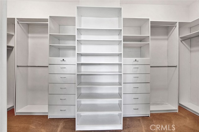 Spacious walk-in closet with built-in's.