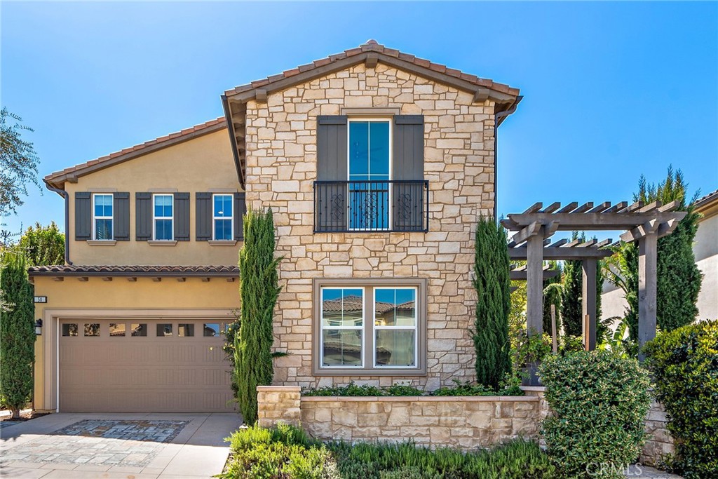 Welcome to 50 Cooper — A Toll Brothers Masterpiece with Stunning City and Mountain Views!Discover the pinnacle of luxury living in this exquisite Toll Brothers model home, perfectly positioned on a rare single-loaded lot in the prestigious Baker Ranch community. With no rear neighbors, this home offers breathtaking panoramic views of the city and surrounding mountains, creating a serene and private retreat.From the moment you enter, the grand curved staircase makes a striking impression, setting the tone for the elegant design and thoughtful details throughout the home. The open-concept floor plan is enhanced by expansive sliding glass doors that seamlessly connect indoor and outdoor living spaces, filling the home with natural light and providing effortless access to the resort-style backyard.This beautifully designed home features 5 bedrooms and 5.5 bathrooms, including a gourmet chef’s kitchen equipped with premium stainless steel appliances, custom cabinetry, a large center island, and a spacious walk-in pantry — perfect for entertaining.The luxurious primary suite serves as a private sanctuary, featuring a spacious balcony with breathtaking views, ideal for morning coffee or evening relaxation. The spa-like ensuite bathroom includes a deep soaking tub, glass-enclosed shower, dual vanities, and a generous walk-in closet.Step into the backyard and experience resort-style living with a sparkling swimming pool, a built-in BBQ, and a spacious patio surrounded by lush landscaping — perfect for hosting gatherings or simply unwinding while enjoying the tranquil views.Located in the award-winning Baker Ranch community, residents enjoy access to resort-style pools, clubhouses, sports courts, scenic walking trails, and playgrounds — all with no Mello-Roos and low HOA fees.This rare Toll Brothers model home offers the perfect blend of luxury, privacy, and natural beauty. Don’t miss this extraordinary opportunity — schedule your private tour today!