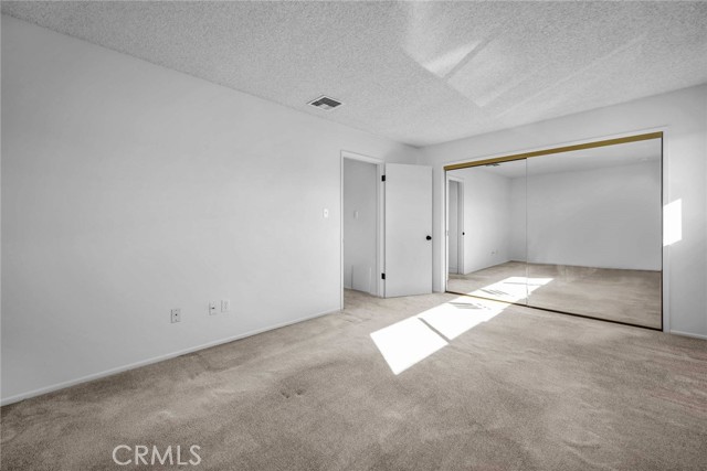 Larger bedroom with mirror closet