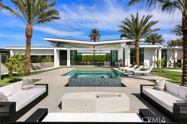 2 Makena Lane Rancho Mirage, California Welcome to this newly constructed masterpiece within the prestigious gated enclave of Makena at Rancho Mirage. From the moment you enter the courtyard gates, the clean modern architecture of this spa-themed home with expansive ceiling heights and resort pool/spa will truly take your breath away. This estate property is perfectly situated on a king-size lot of over 1/2 an acre with stunning views of the surrounding mountains. The home offers walls of glass, pocket sliding doors, pool, infinity spa, outdoor fire pit, zen garden and bocce ball court. The 4,350 s/f residence offers 4 Bedrooms 4.5 Baths, lavish master suite with sitting area, large entertaining areas and a 3-car garage. State of the art kitchen with custom cabinetry and culinary appliances are just a few of the property amenities. This sensational property should not be missed. Furnishings can be purchased separately.