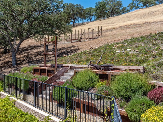 Upper lot garden area. Deer fenced kitchen garden visible