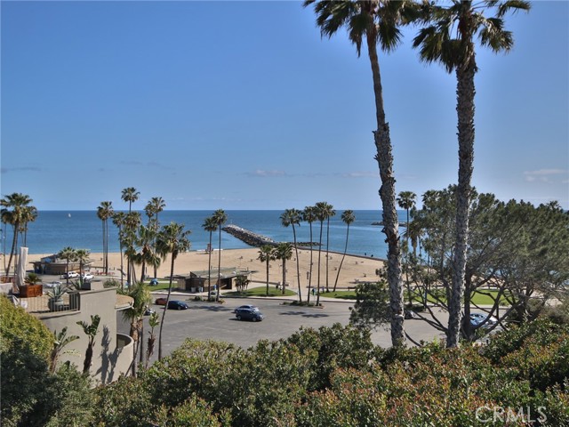 The beach is right next to the entry to Newport Harbor