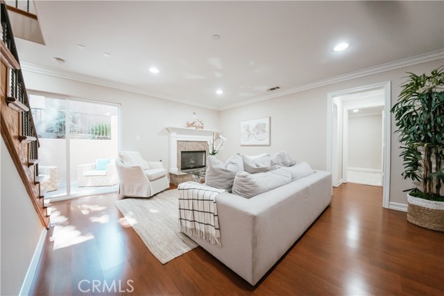 Downstairs den with Fireplace opens up to the backyard