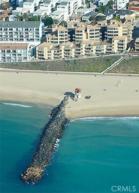 Pristine Sandy Beach with Rock Jetty