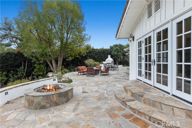 Upper patio with firepit, outdoor kitchen and plenty of room for entertaining