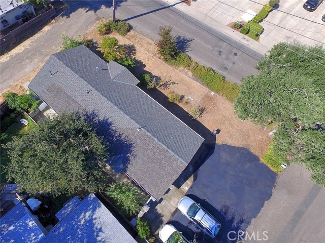 Overhead View of Home, (4) car parking, front yard and back.