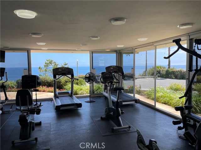 Gym with Sliding doors to a patio