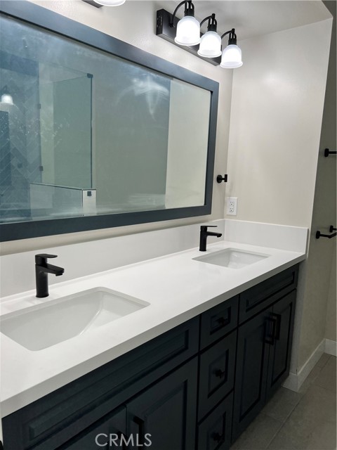 secondary bathroom upstairs with custom vanity