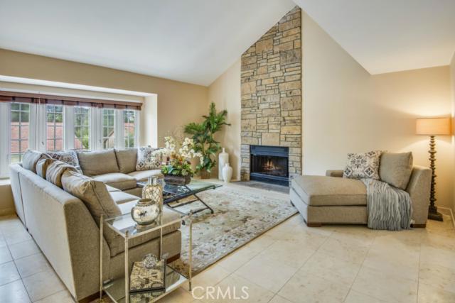 Beautiful formal living room with fireplace and gorgeous stone mantle.  There is a room as an office adjacent to this room.