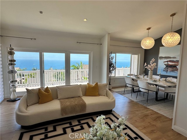 Panoramic ocean view through living rm and dining rm
