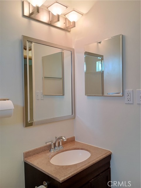 granite counter in the bathroom and newer light features