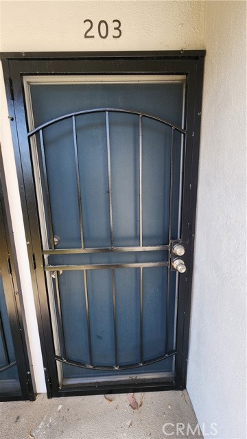 Entrance has security screen door so harder for people to see in