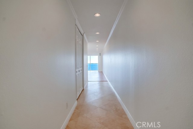 This is your entry. Plenty of storage in the closet along the travertine walkway.