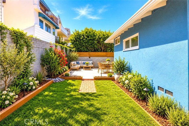 The Rear Yard which Adjoins the Patio Offers a Sheltered and Private Area for Entertaining or Relaxing. The Wrap Around Sideyard also leads t0 the Large Front Yard. Virtually Staged