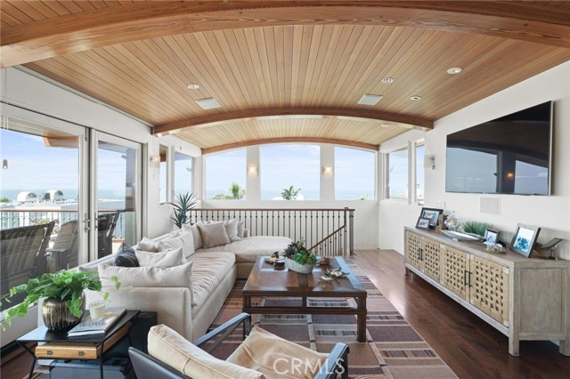 Top floor living area drenched in natural light and ocean views