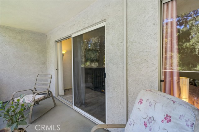 Lovely balcony overlooking trees and neighborhood views.