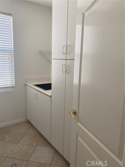 Laundry room storage and stainless sink