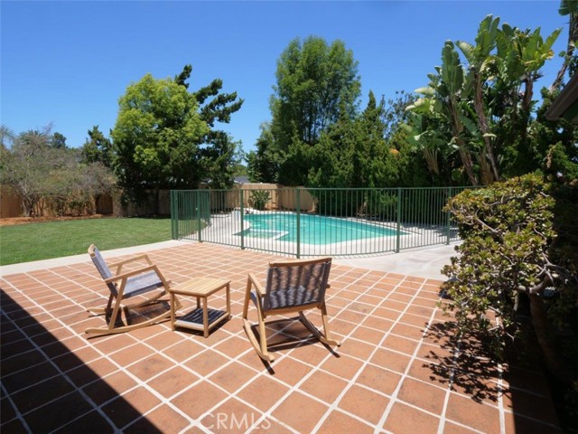 Large patio in the heart of the backyard easily accessed from living room, family room and office/4th bedroom.